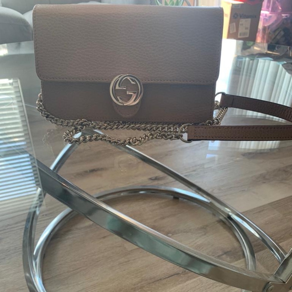 Brand New!!! Great buy. Can be worn as an evening bag or everyday bag.